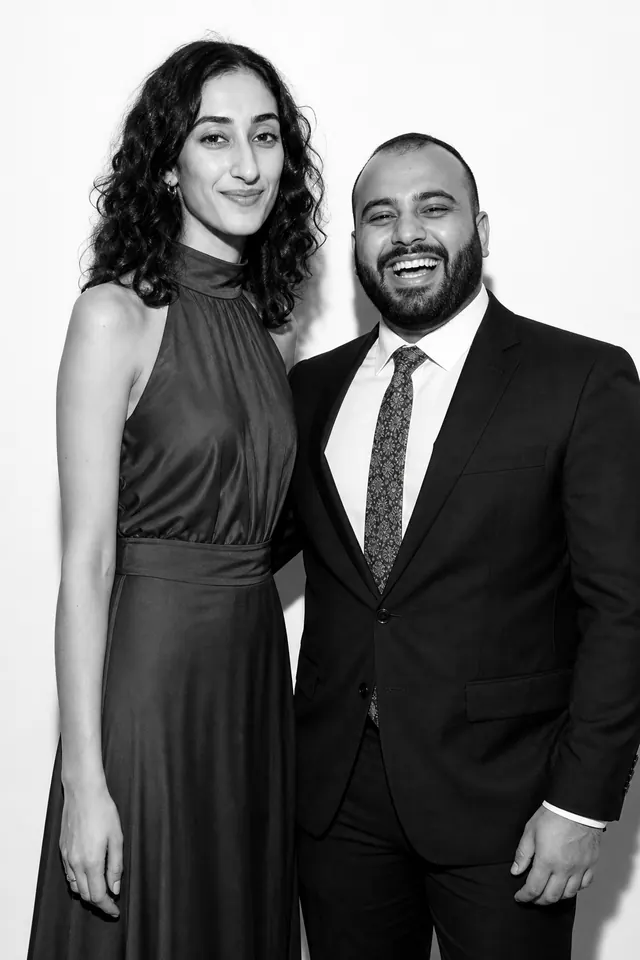 Guests posing for a polished black-and-white Glam Booth portrait, photo 7