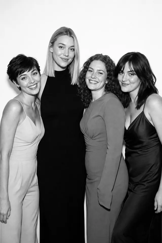 Guests posing for a polished black-and-white Glam Booth portrait, photo 9