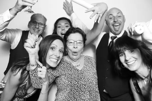 Guests posing for a polished black-and-white Glam Booth portrait, photo 11