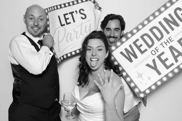 Guests posing for a polished black-and-white Glam Booth portrait, photo 12