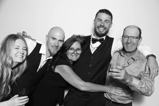 Guests posing for a polished black-and-white Glam Booth portrait, photo 20
