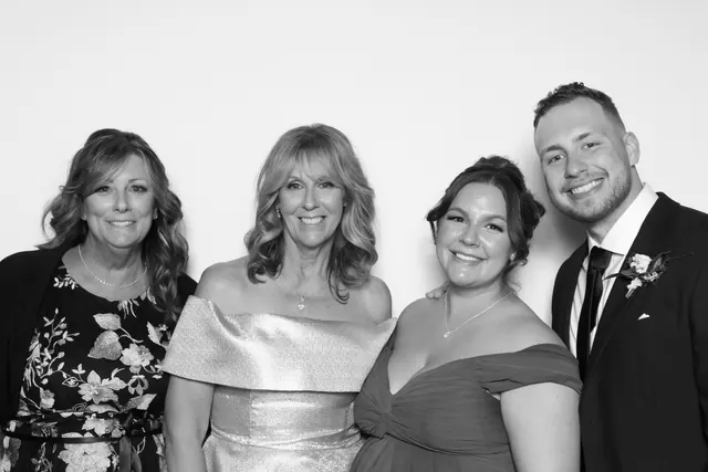 Guests posing for a polished black-and-white Glam Booth portrait, photo 21