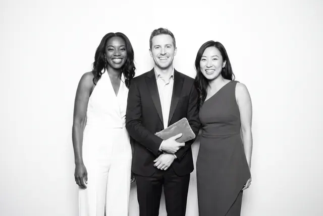Guests posing for a polished black-and-white Glam Booth portrait, photo 28