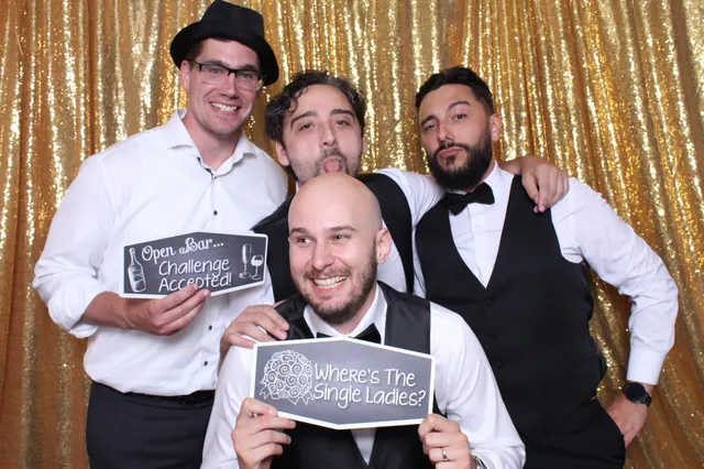 Guests enjoying a photo booth with a gold sequin backdrop, photo 16