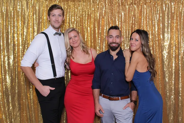 Guests enjoying a photo booth with a gold sequin backdrop, photo 20