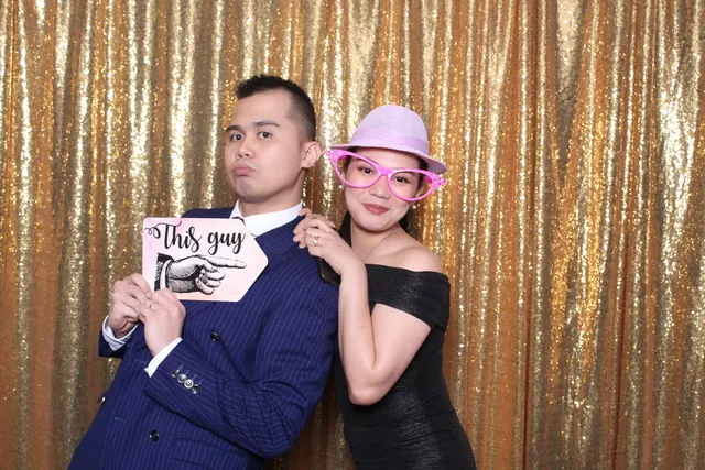 Guests enjoying a photo booth with a gold sequin backdrop, photo 26